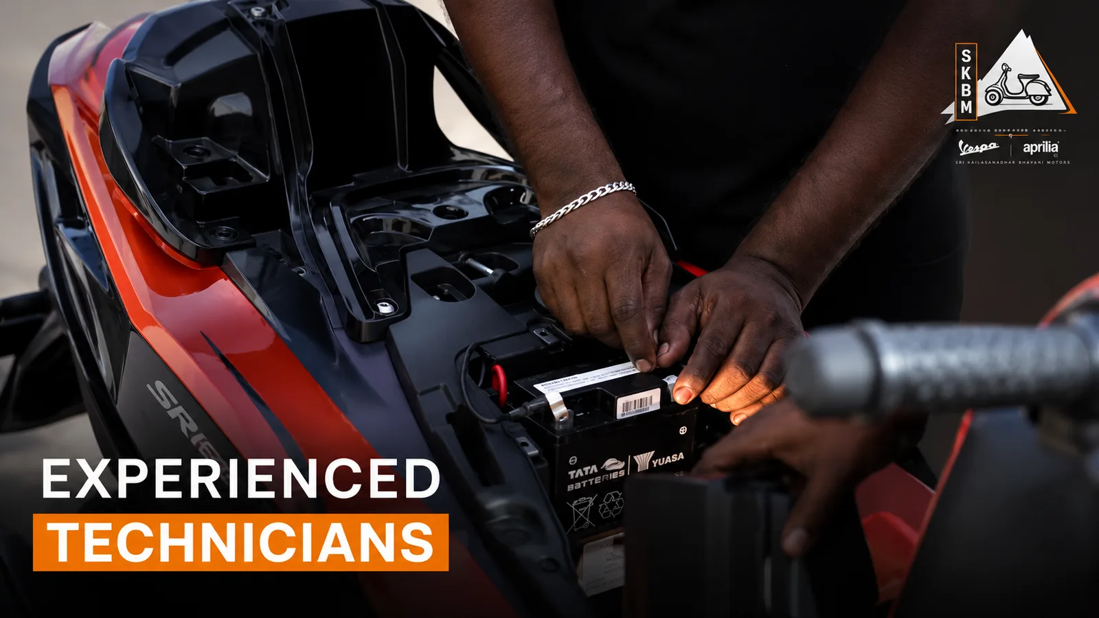 An SKBM technician fitting a new battery
