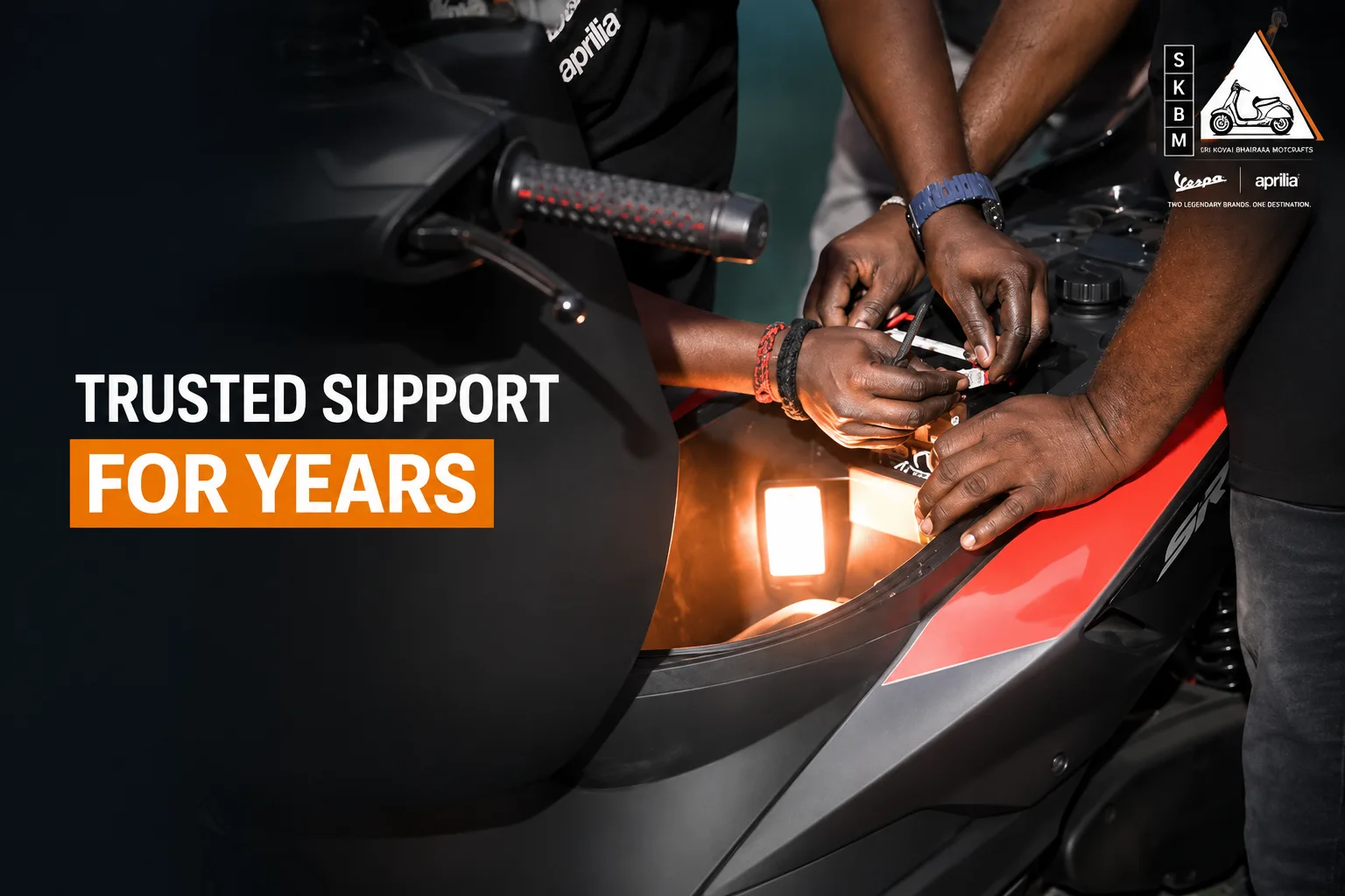SKBM technicians working on an Aprilia SR